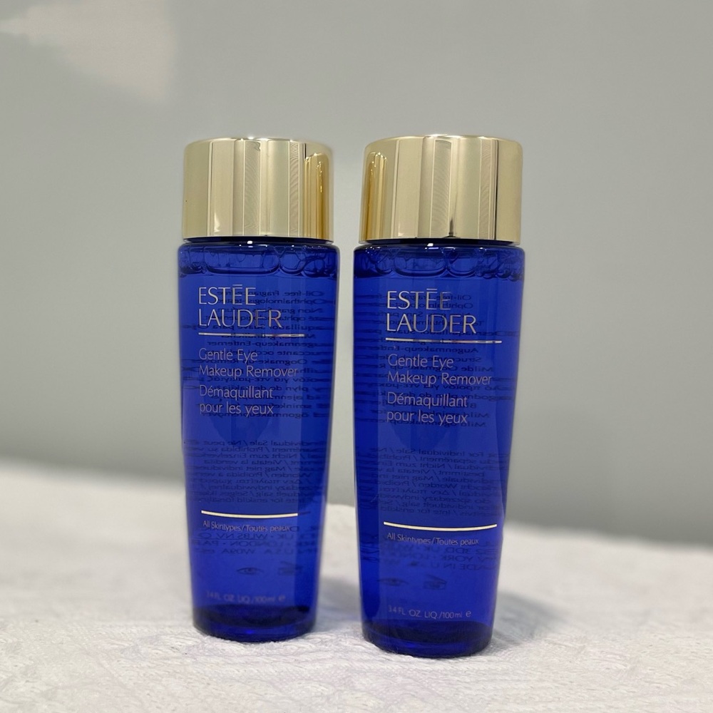 Two bottles of Estee lauder makeup remover